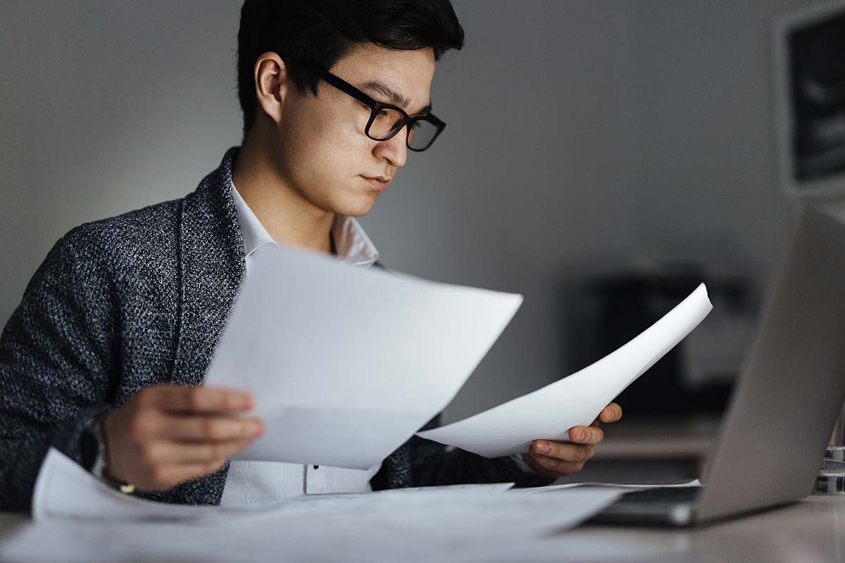 man reading documents
