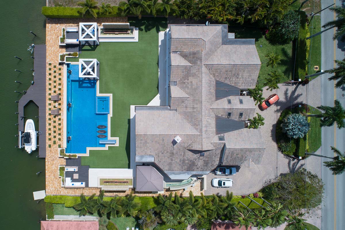 expensive mansion with pool and dock