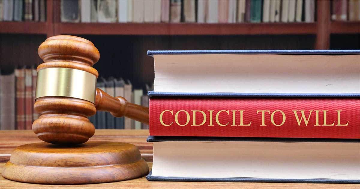a Codicil to will book on table with a judge's gavel