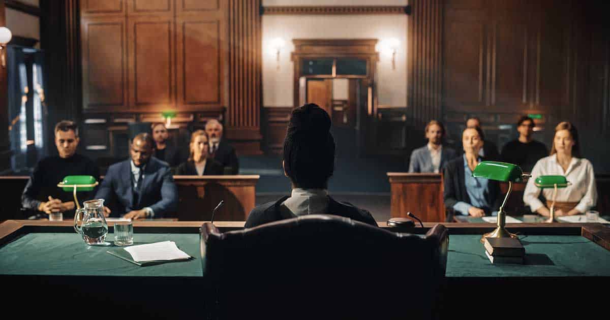 a trial in a court room with a judge present