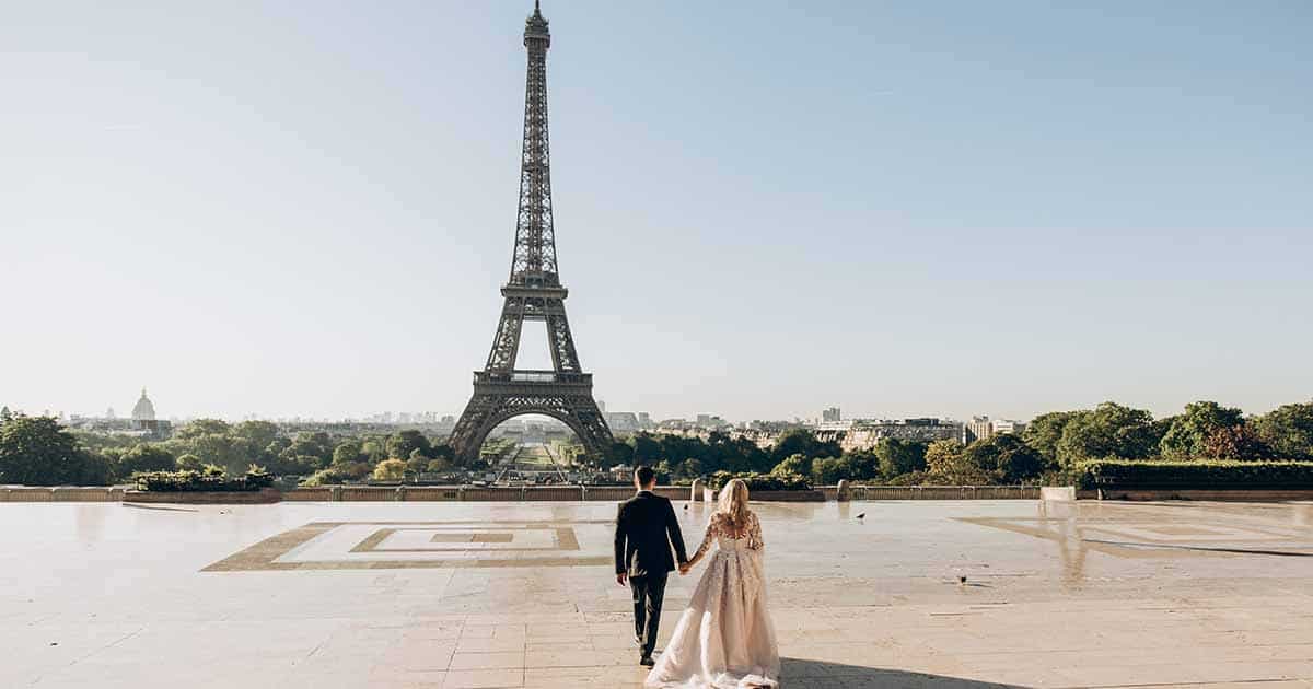 couple married in Paris, standing in front of the Eiffel Tower