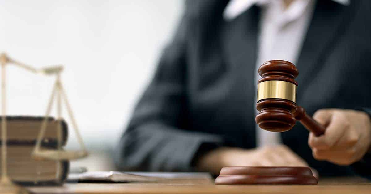 Female Judge with gavel on table