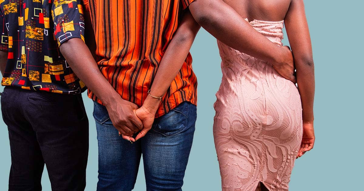 A woman with her boyfriend holds hands with her lover, infidelity