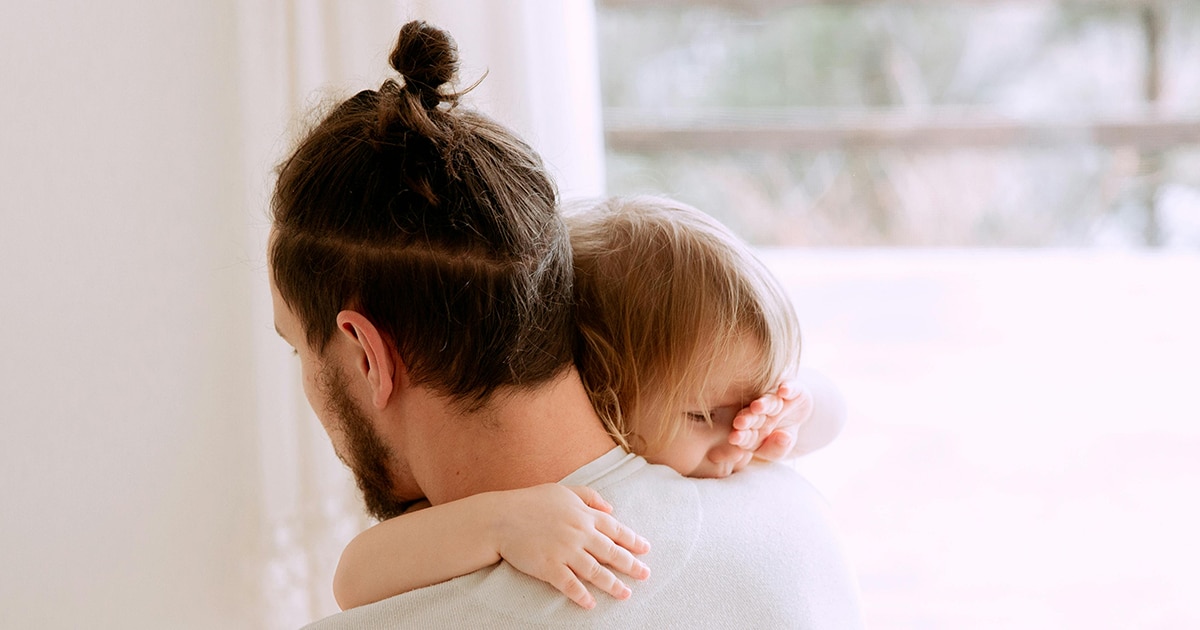 Photo Of Man Carrying Child