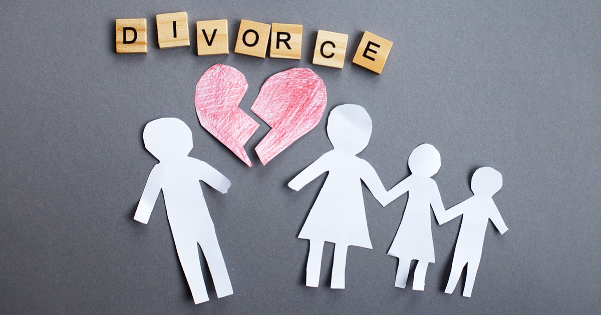 Paper chain cut family with broken heart on gray background. Divorce and broken family concept.